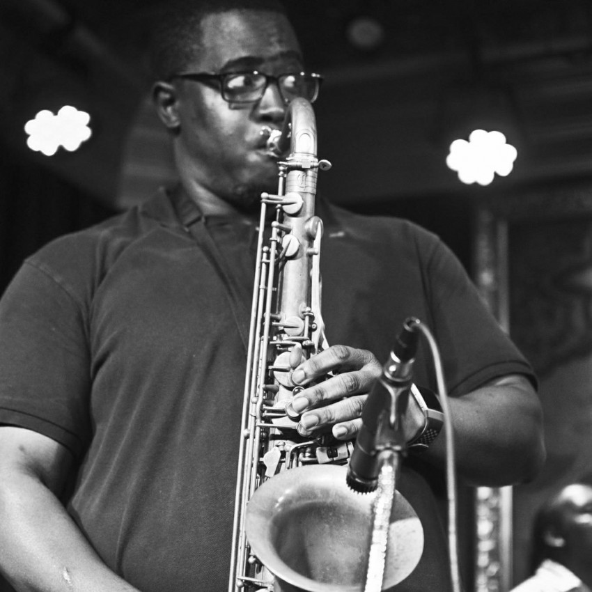 Charae Hosey on saxophone — black and white performance photo
